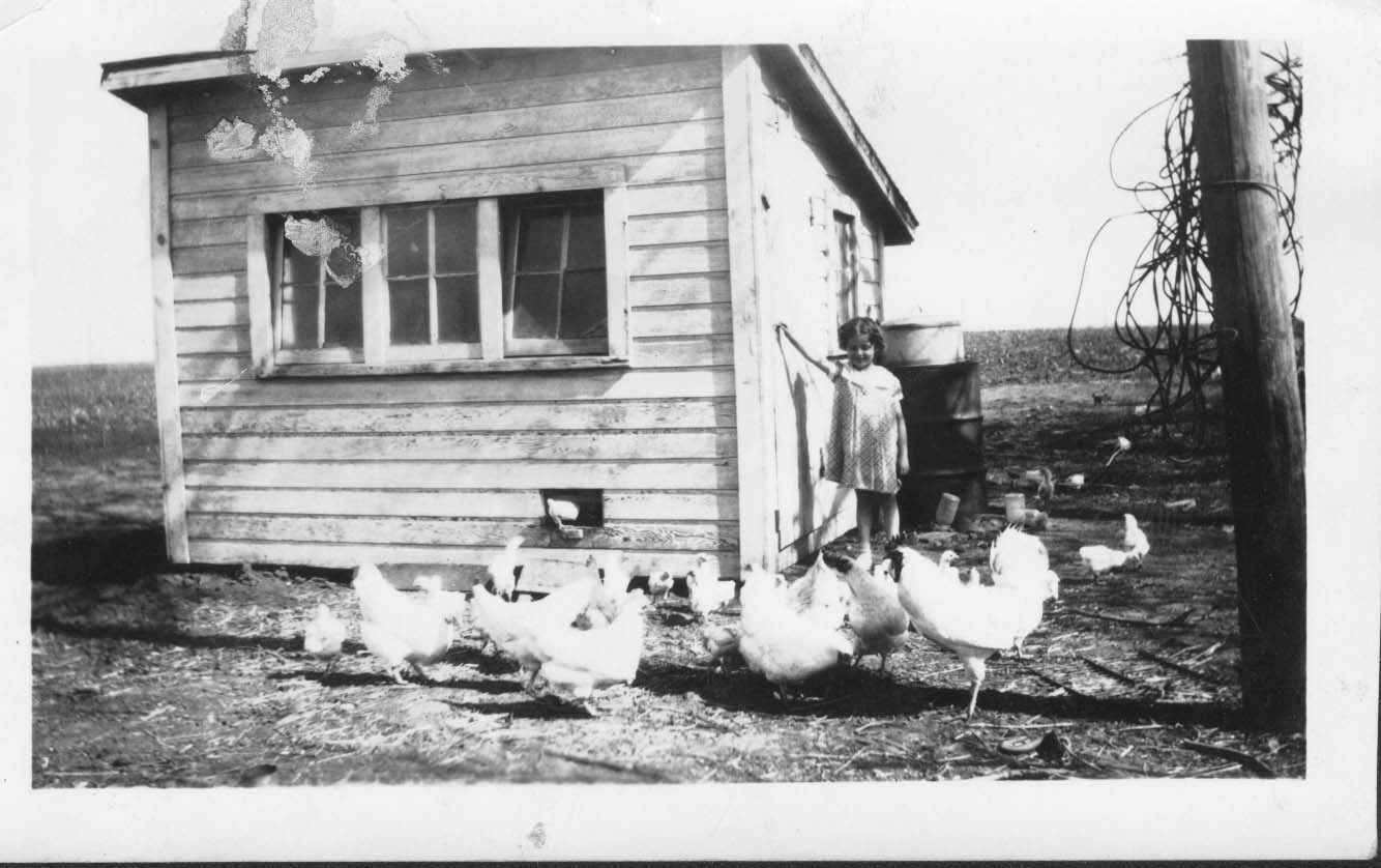 Marie by the chicken coop in ~1935